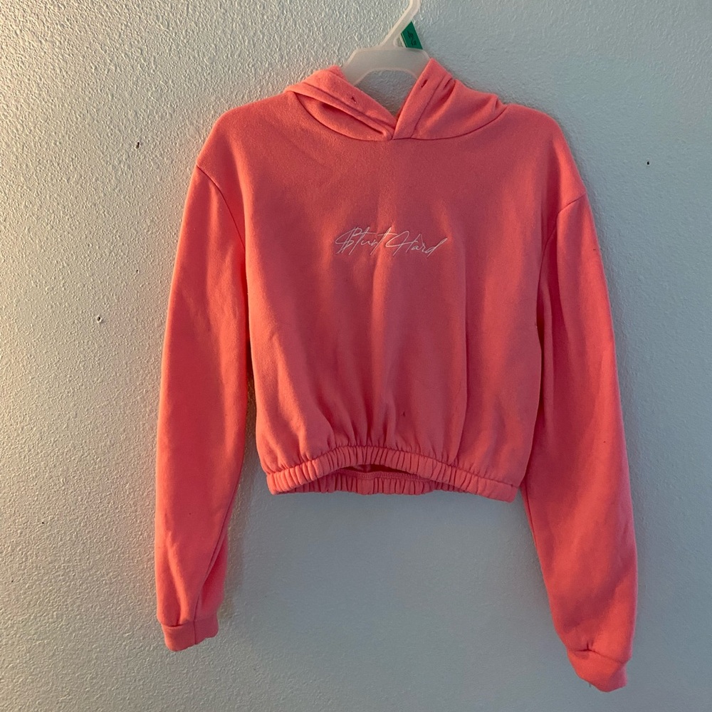 Pink hoodie with words stunt hard in white.